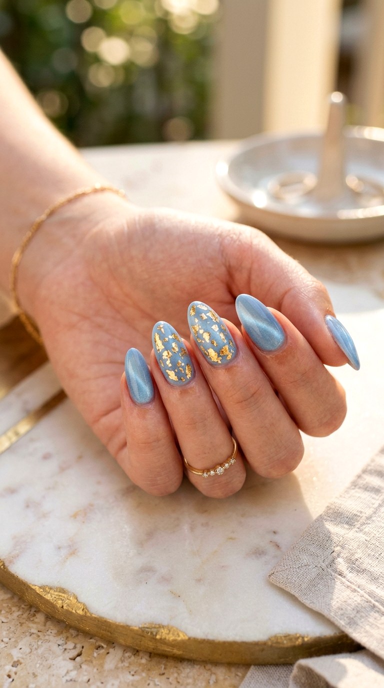 Baby Blue Cat Eye with Gold Foil - 20 Summer Baby Blue Cat Eye Nails Ideas
