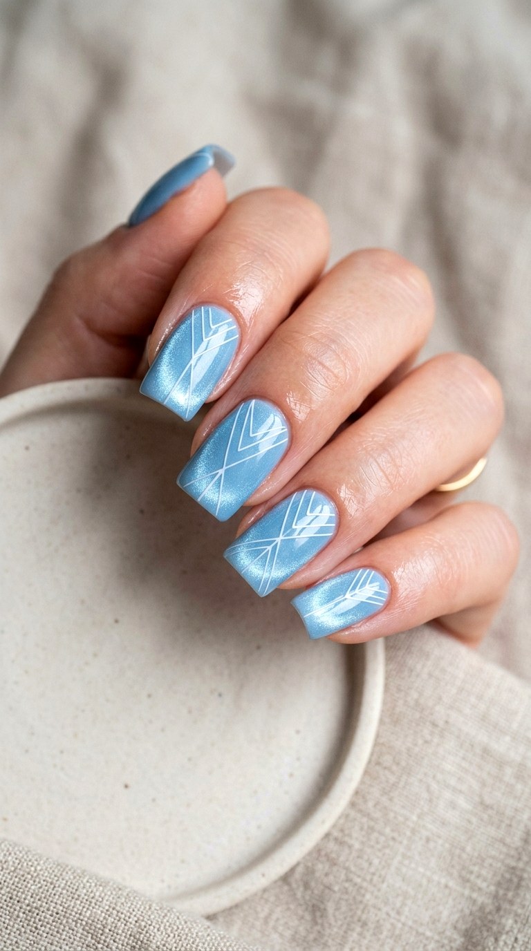 Baby Blue Cat Eye with White Lines - 20 Spring Baby Blue Cat Eye Nails Ideas