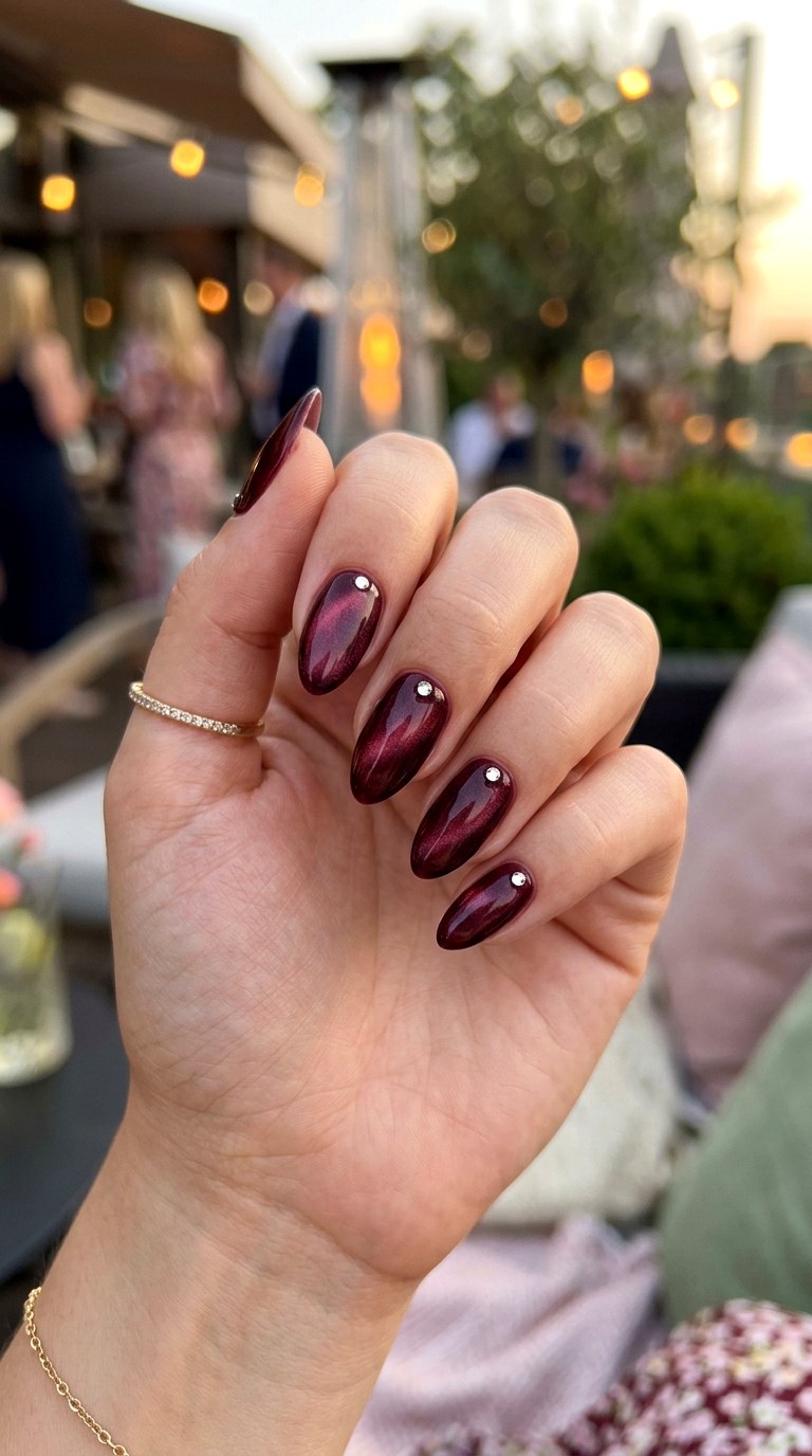 Burgundy Cat Eye with Minimal Crystal Corners - 21 Summer Crystal Accent Cat Eye Nails Ideas