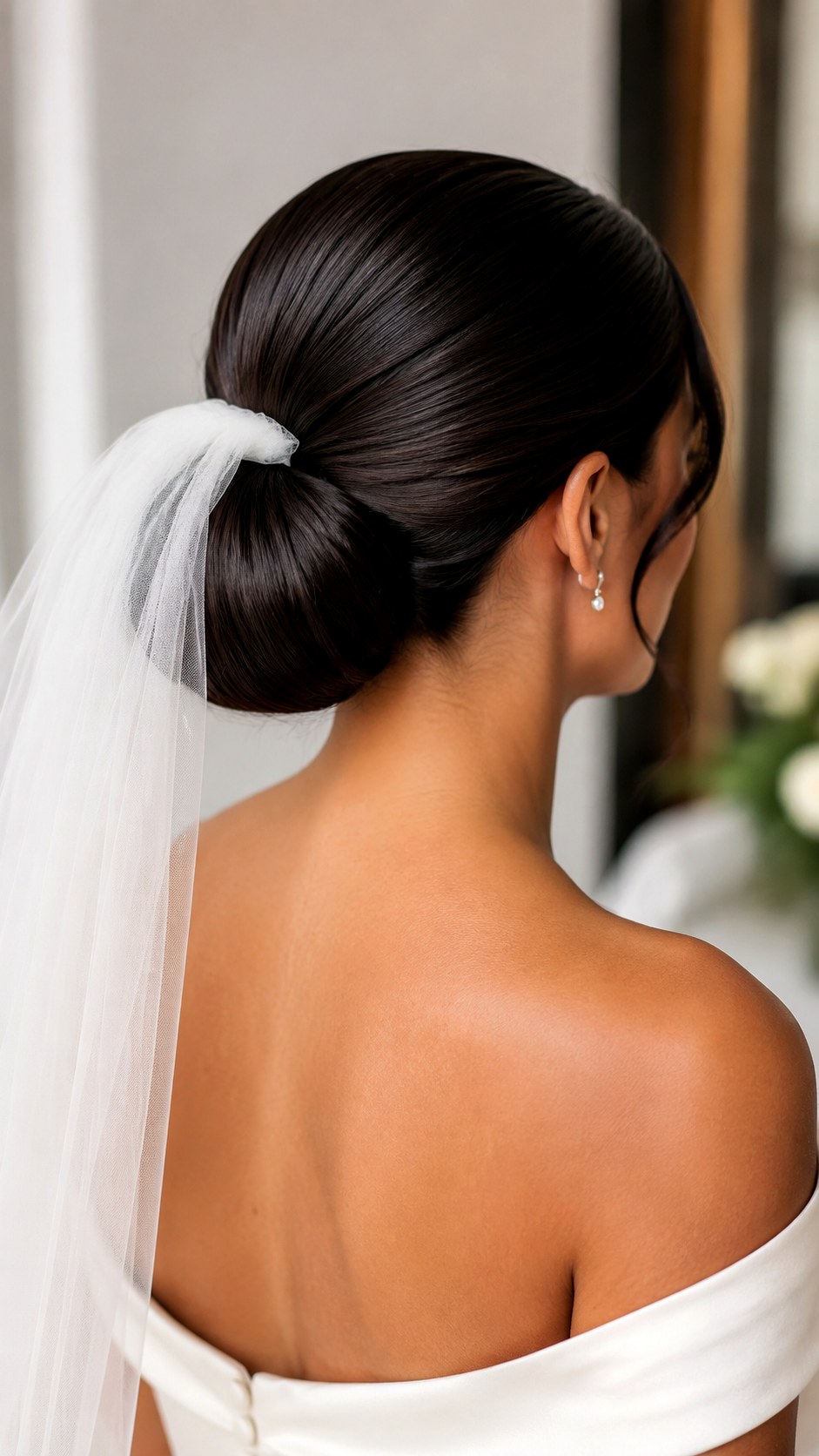Classic Glossy Low Knot Bridal Updo - 25 low bun hairstyles wedding ideas