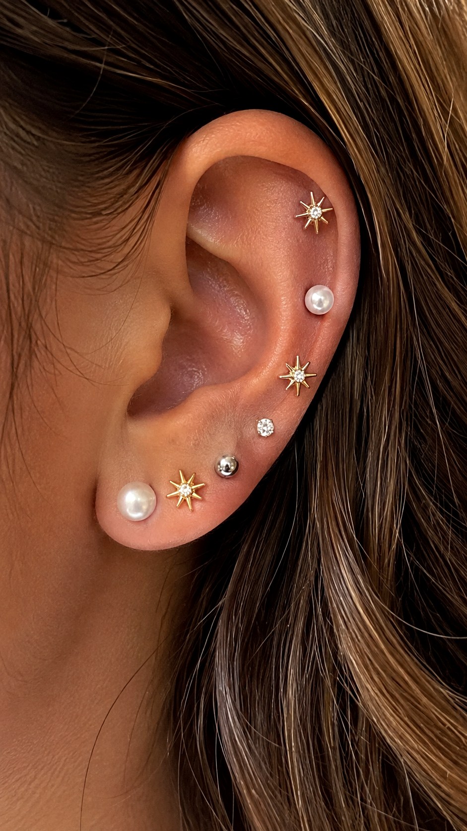 Earlobe Curation With Mixed Metal Studs - 24 gold vs silver jewelry ideas