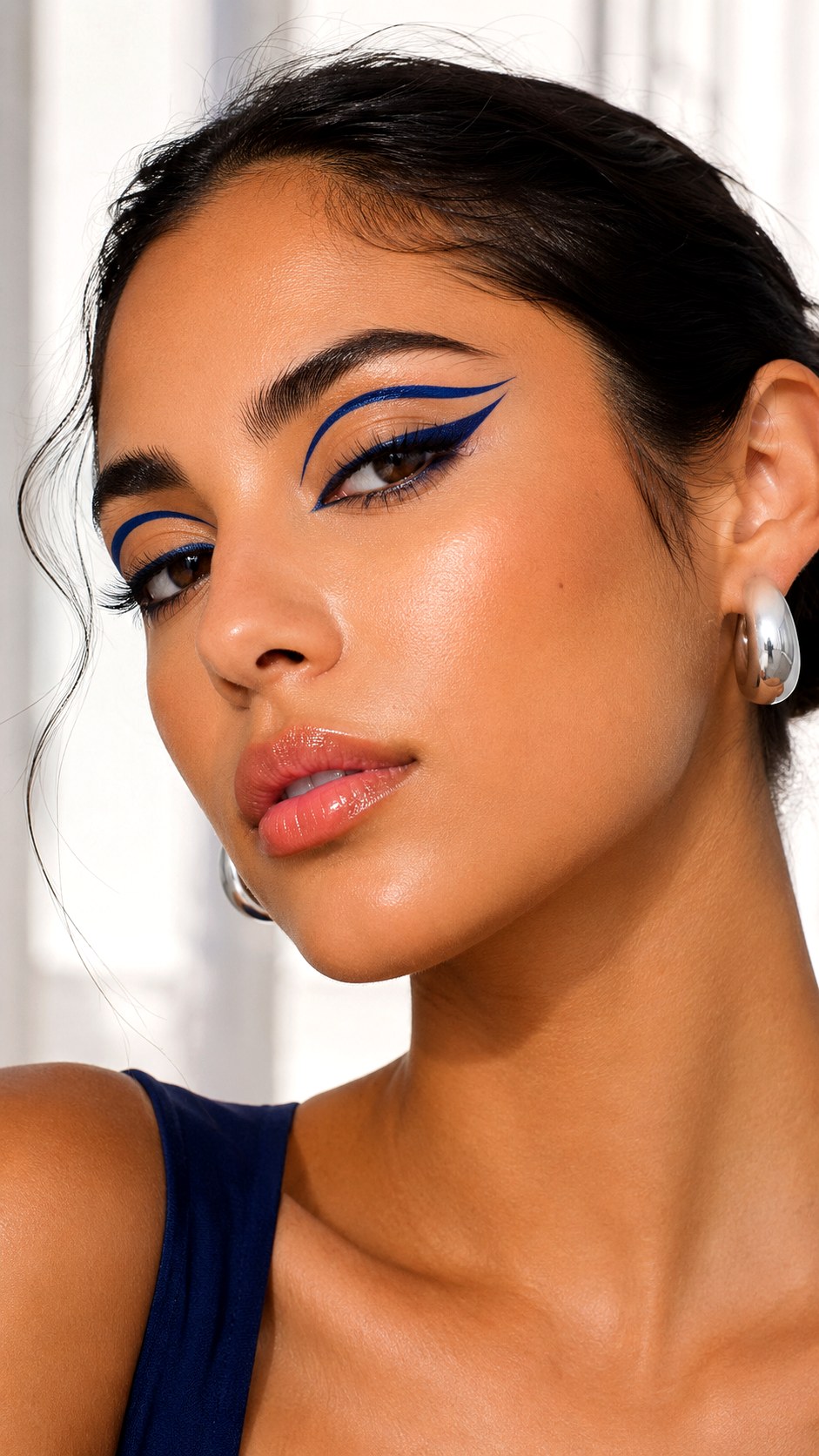 Graphic Navy Blue Eyeliner Statement - 24 Olive Skin Makeup Looks