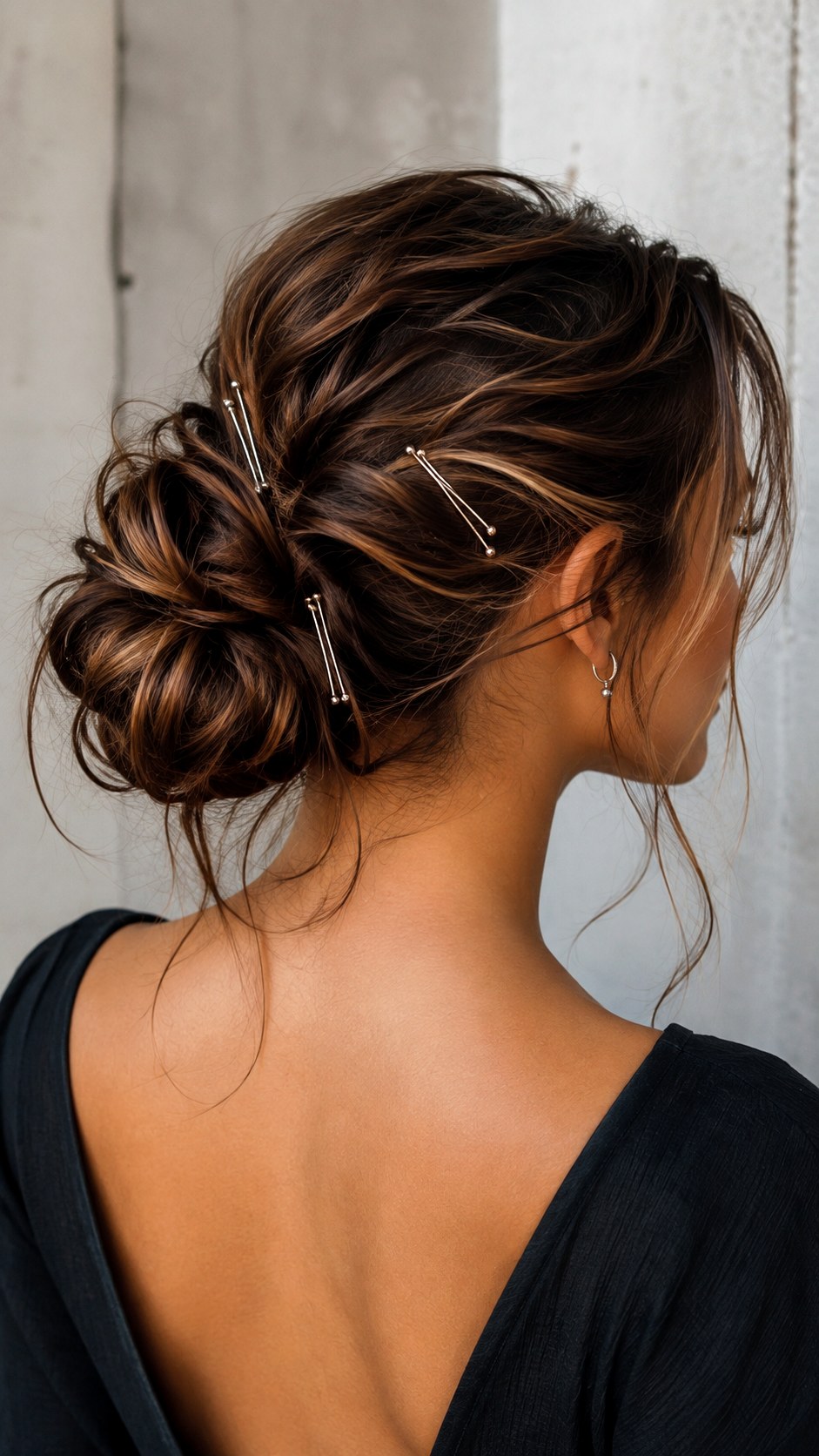 Low Messy Bun with Delicate Silver Pins - 25 low bun hairstyles wedding ideas