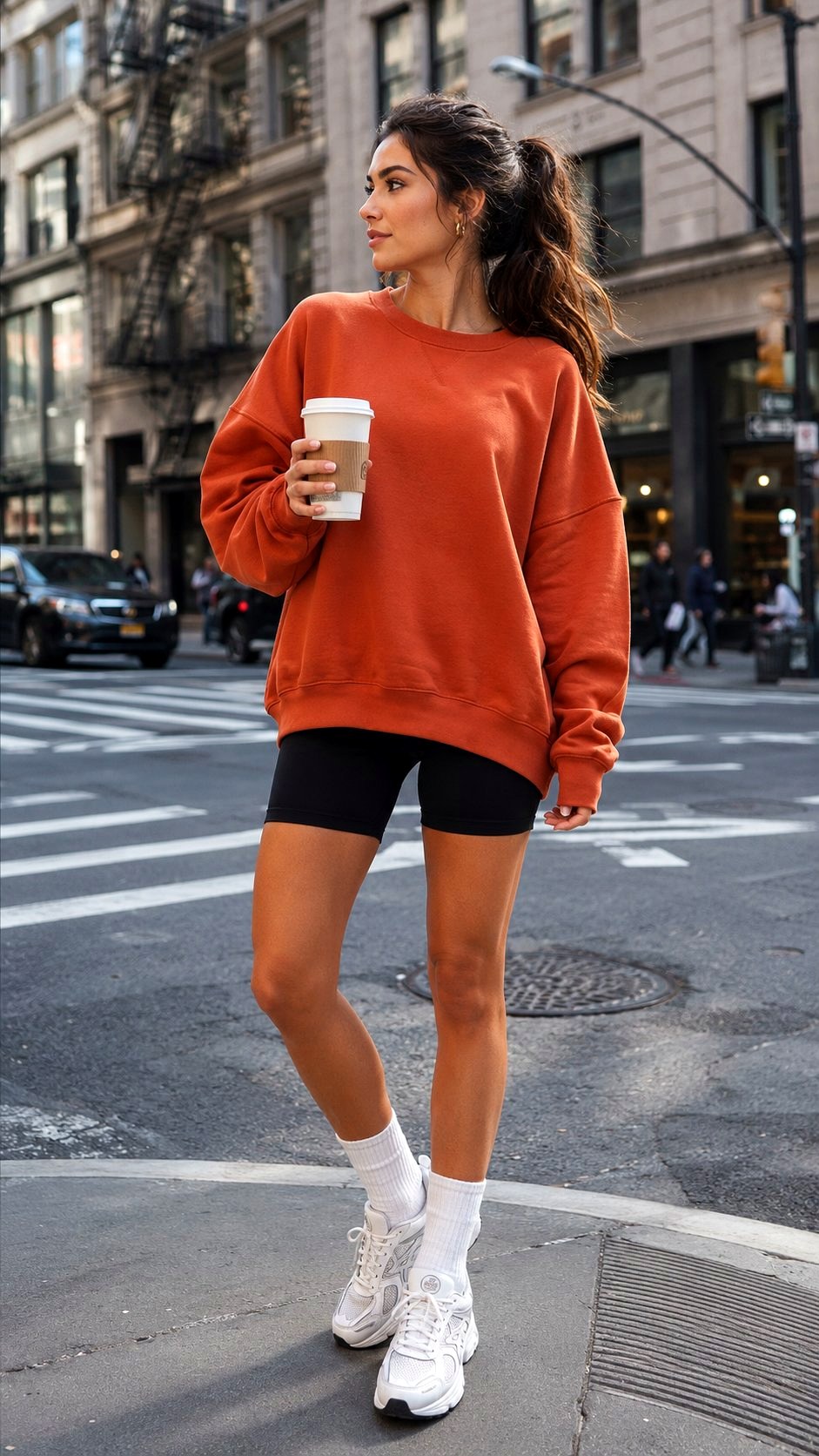 Oversized Orange Sweatshirt with Bike Shorts - 21 Orange Shirt Outfit Ideas
